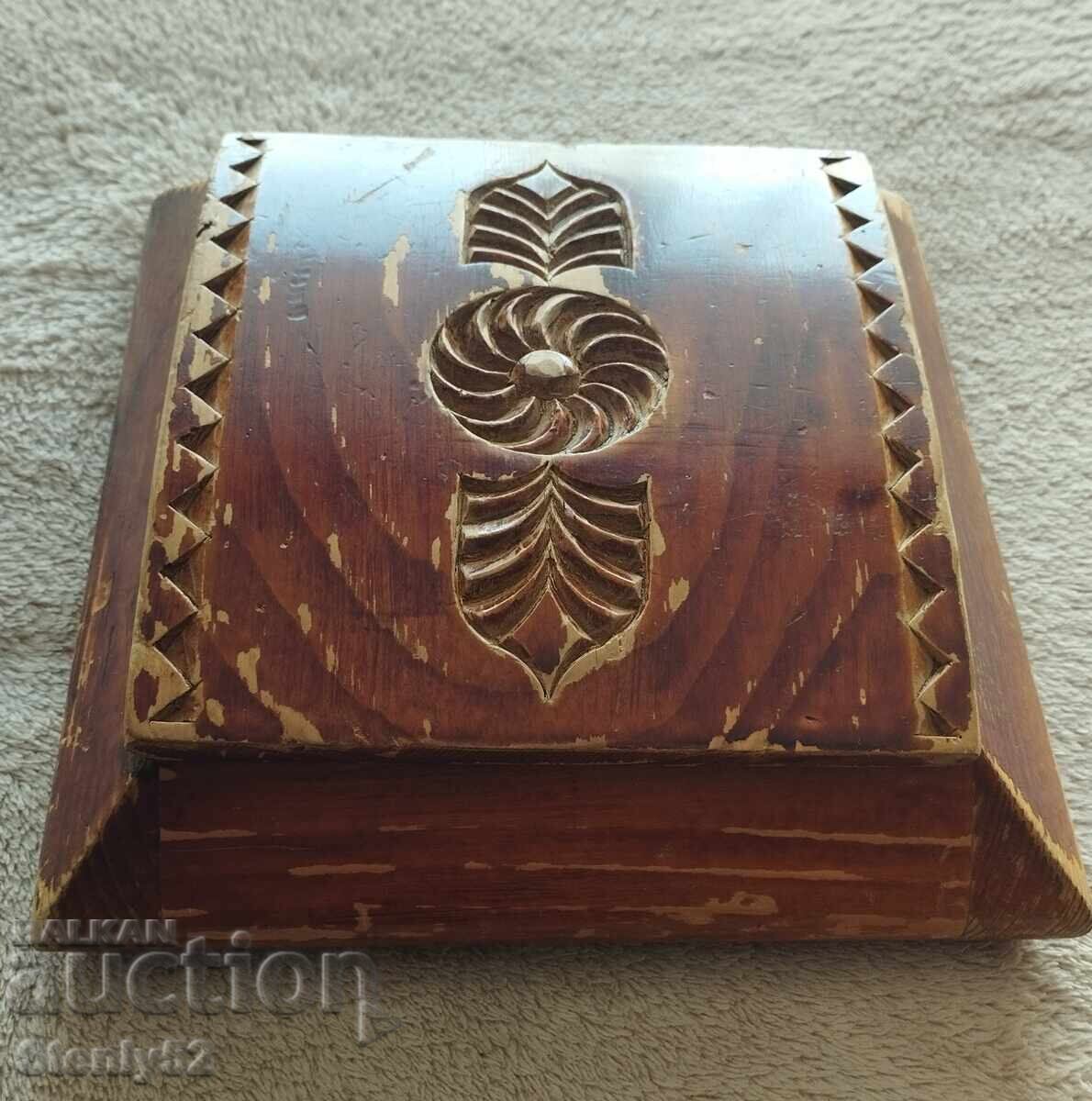 Very old wooden box with wood carving