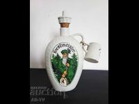Old porcelain flask with cup