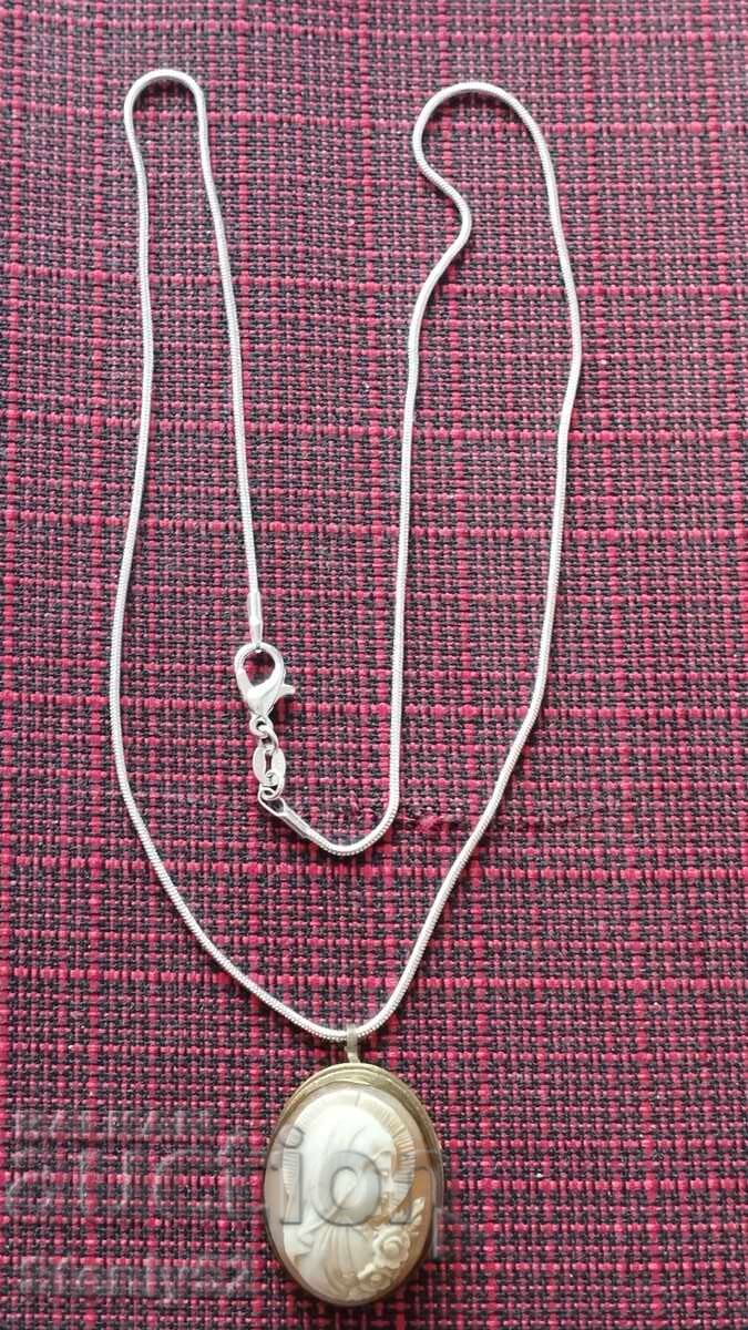 Ivory medallion-brooch with a silver-plated chain with price € 45.00 | 88.01 BGN