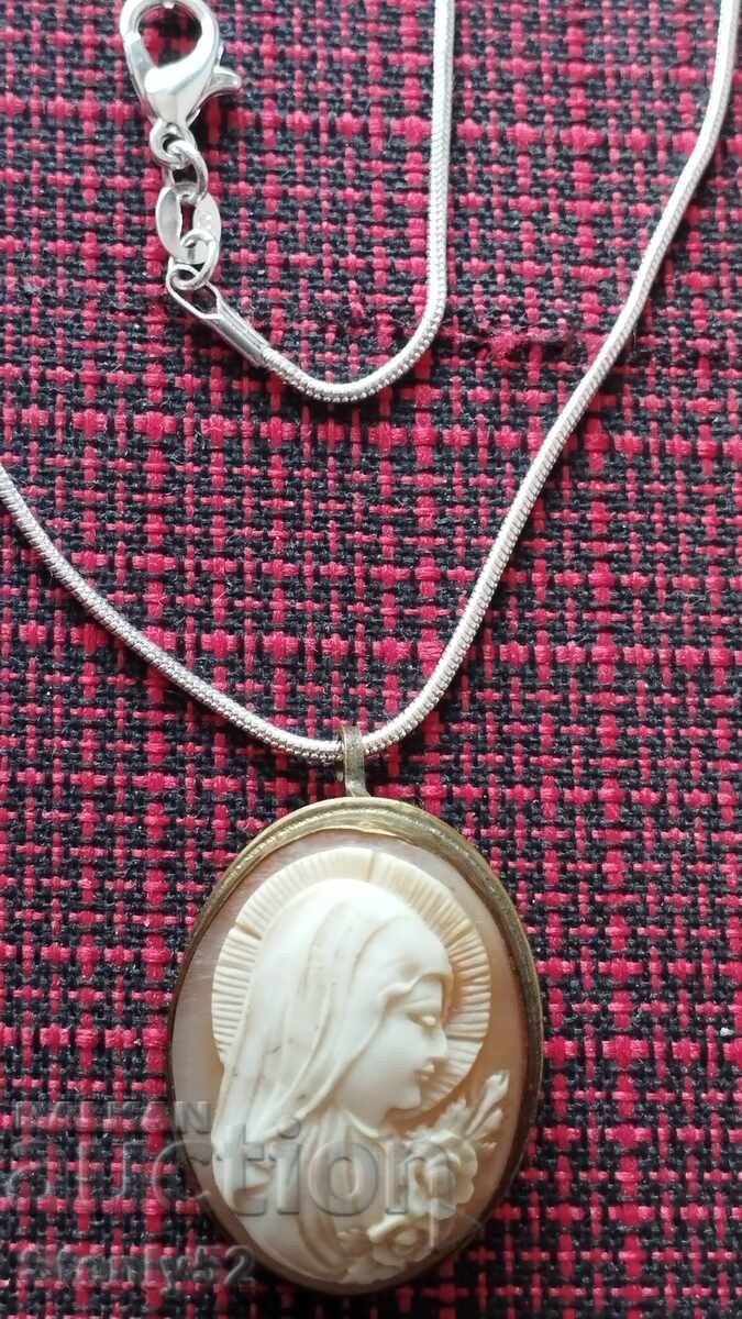 Ivory medallion-brooch with a silver-plated chain