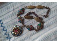 Old necklace with mosaic elements brass
