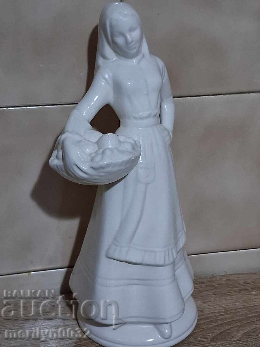 Bulgarian porcelain figure woman in traditional costume with a basket 1975