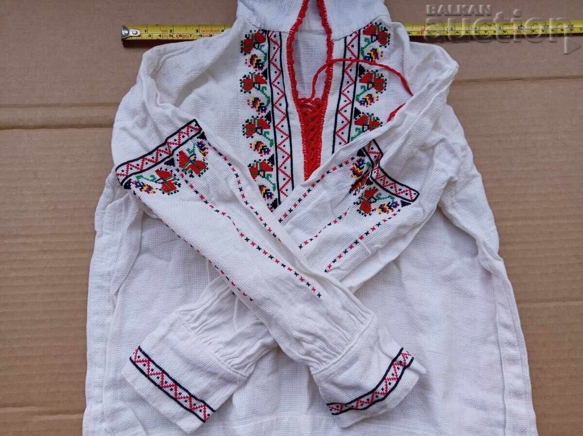 Delivery of Embroidered small shirt (blouse) with traditional costume elements