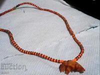 Old elephant bone pendant in an old bead necklace