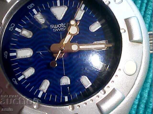 Beautiful Swatch Irony, works perfectly, with a new battery