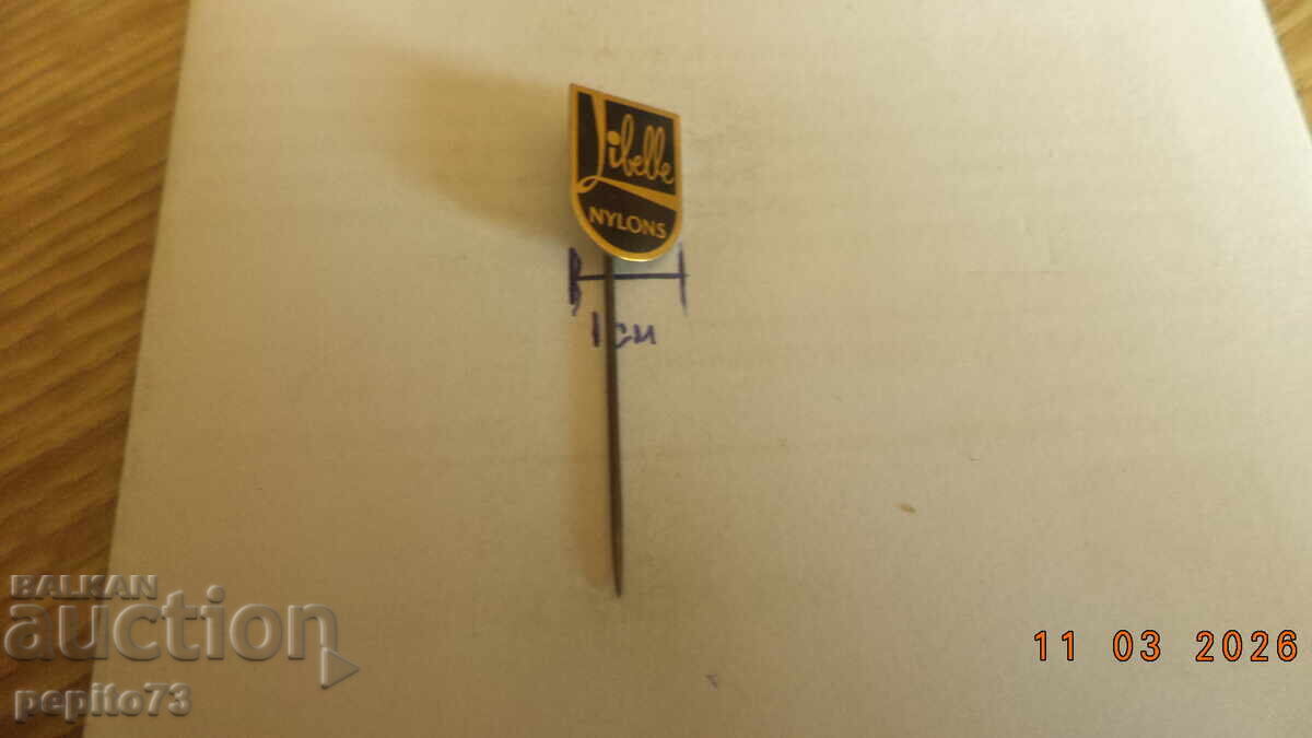 Licitație Insignă publicitară, Libelle Nylons, marcă de ciorapi pentru femei