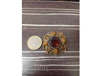 Old gilded brooch