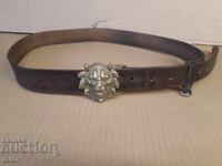 Very old belt with a massive buckle - bronze lion head