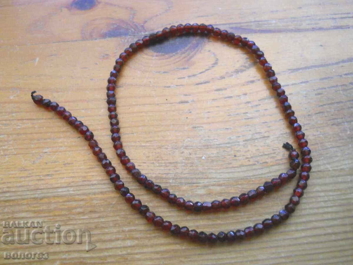 Necklace of faceted natural garnets