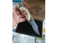 Souvenir pocket knife, made of metal with an animal symbol