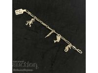 Elegantă brățară argintie cu pandantive decorative