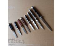 Колекция от автоматично ножове.