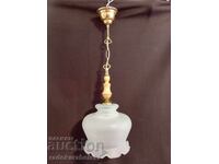 Beautiful chandelier with a large glass lampshade