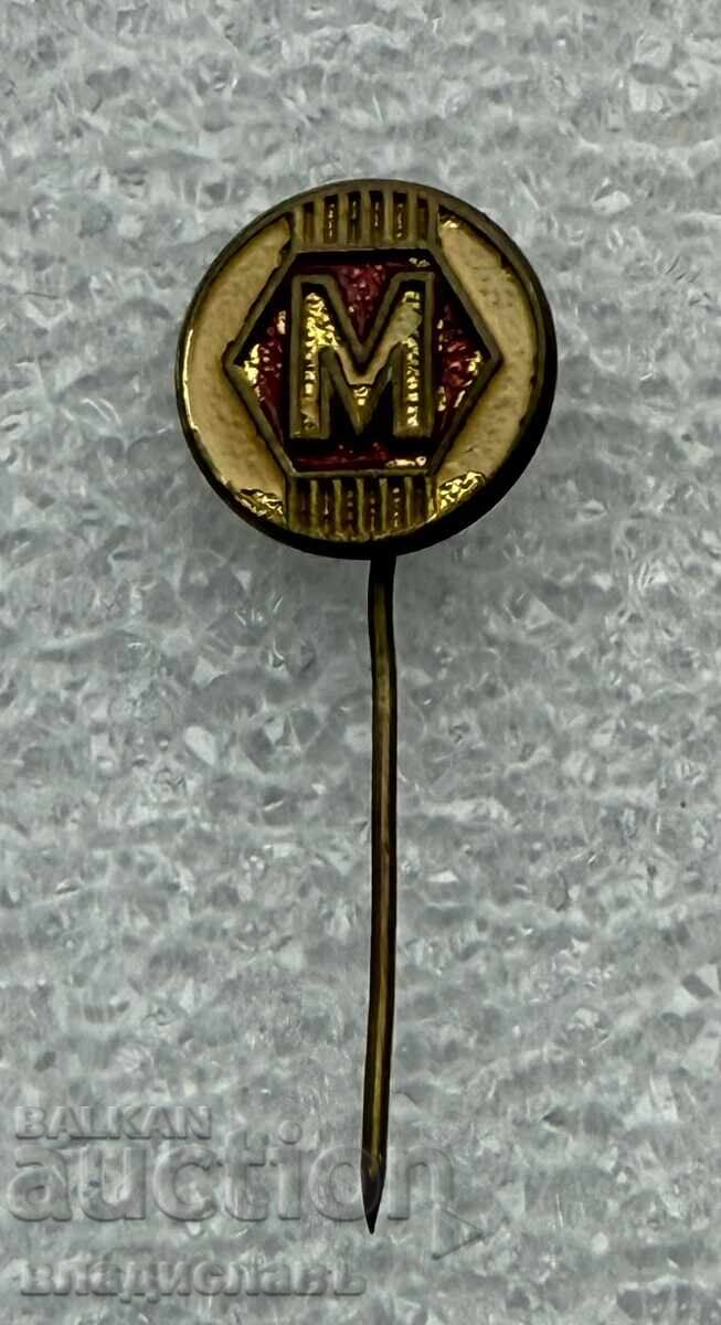 значка М