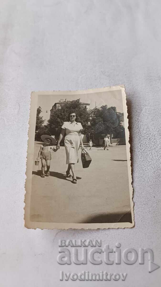 Photo of a Woman and a Little Boy on a Walk