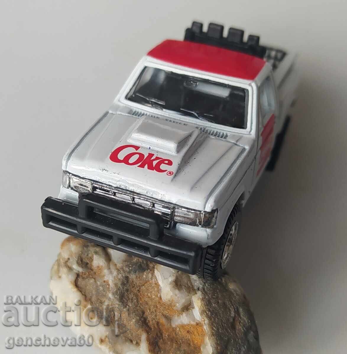 Auction  1988 Pickup truck with Coca-Cola advertisement