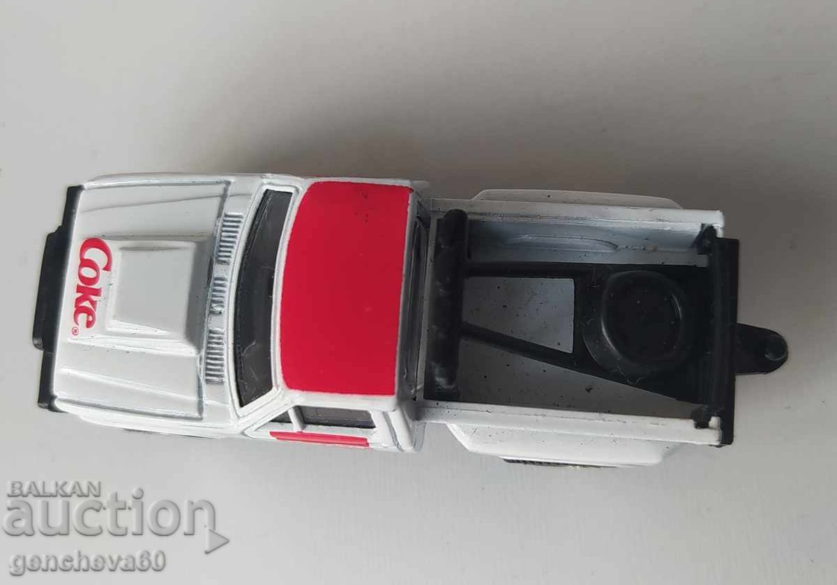 Delivery of 1988 Pickup truck with Coca-Cola advertisement