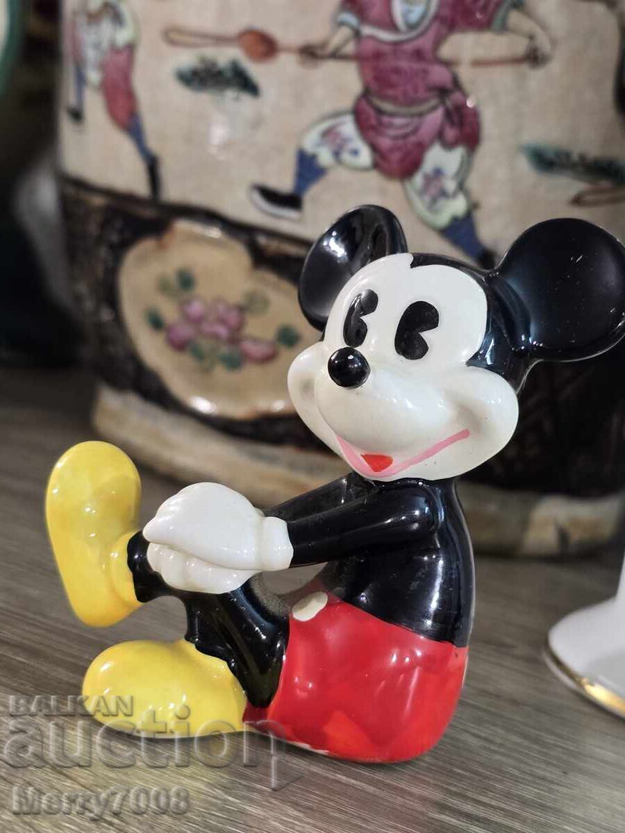 Collectible Mickey Mouse figure, with "Walt Disney" stamp