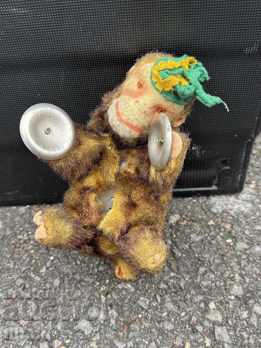 Figurină mecanică veche sub formă de maimuță