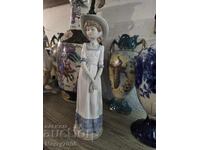 Συλλεκτική πορσελάνινη κούκλα, έργο της μάρκας NAO!