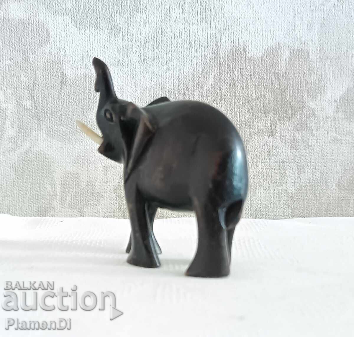 Auction  Hand-carved African elephant figurine. Solid wood