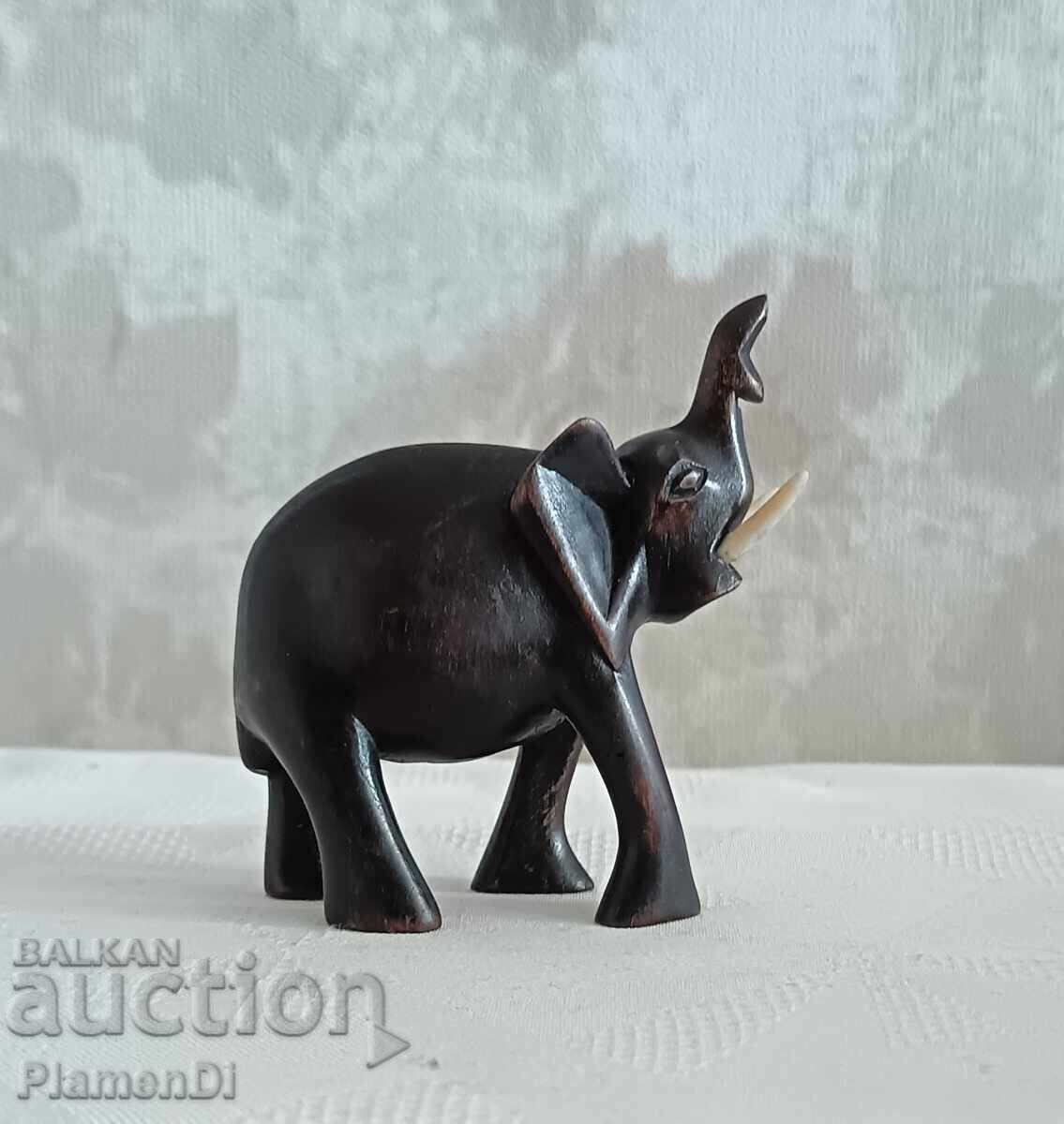 Hand-carved African elephant figurine. Solid wood