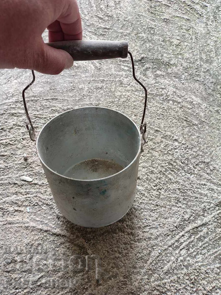Old aluminum milk pot