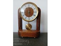 Vintage style quartz clock with moving pendulum