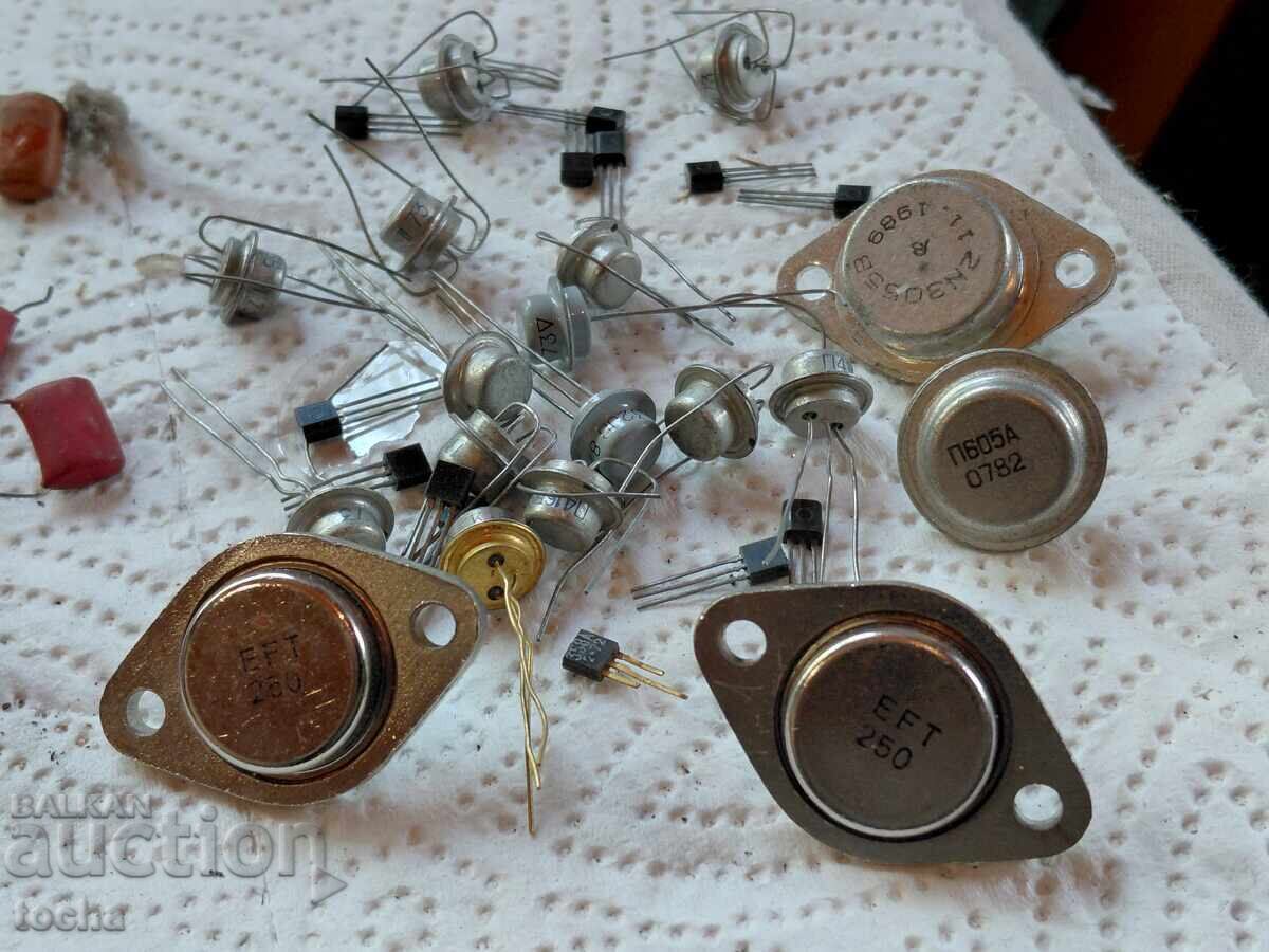 Auction  Lot three, old and new transistors and capacitors, etc