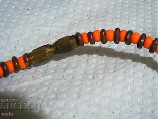 Auction  Old elephant bone pendant in an old bead necklace