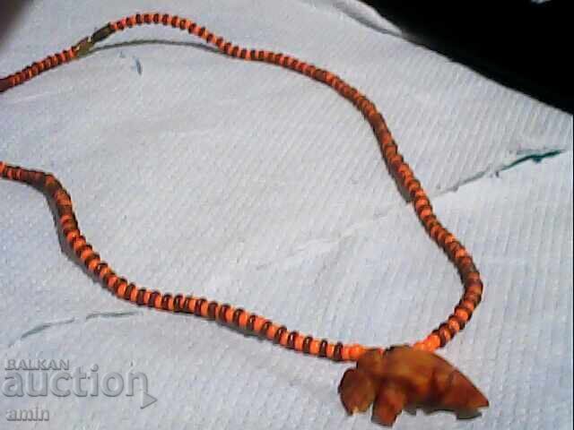 Old elephant bone pendant in an old bead necklace