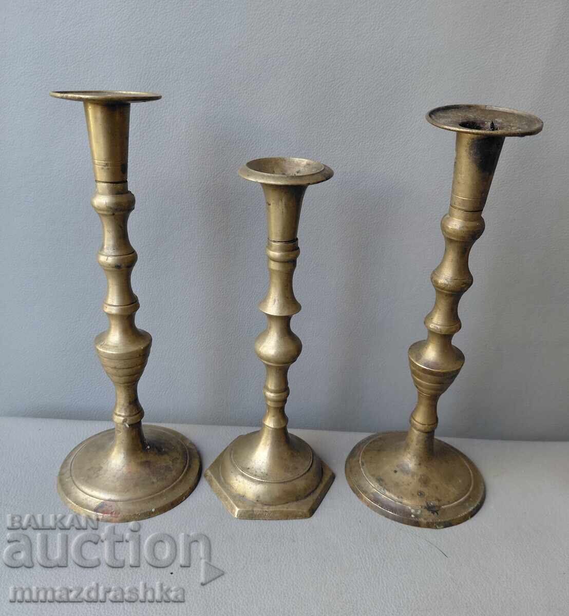 3 bronze candle holders