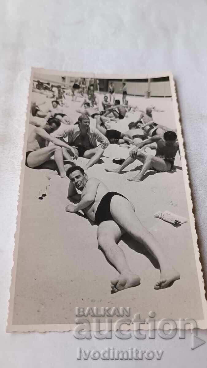 Photo of Men on the Beach