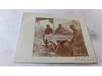 Photo: Three officers having a drink at the front