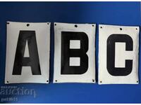 Lot of three enameled signs with letters A B C