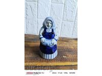 Porcelain figurine of an old woman