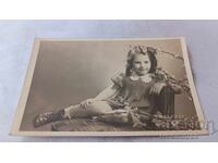 Photo Sofia Little girl sitting on a chair 1942