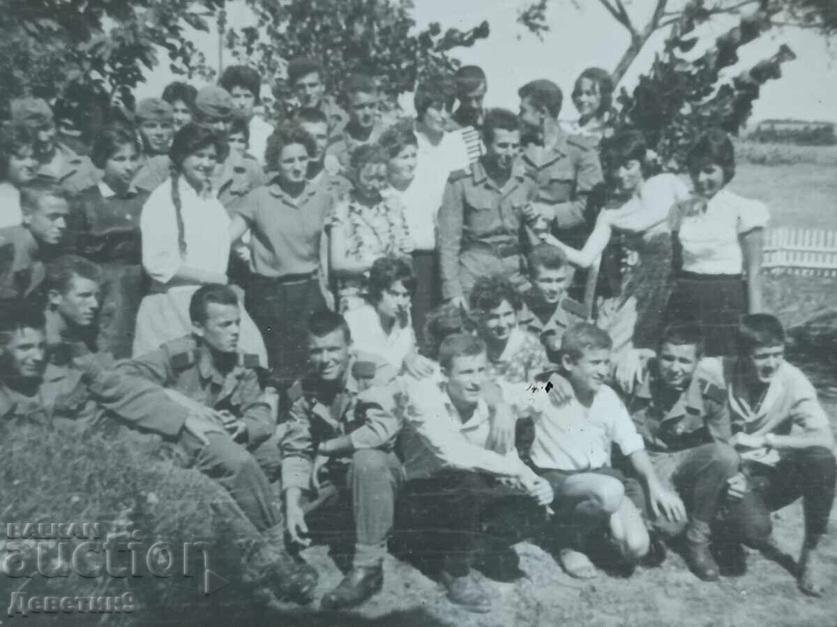 Auction  Uniformed and civilian youths outdoors