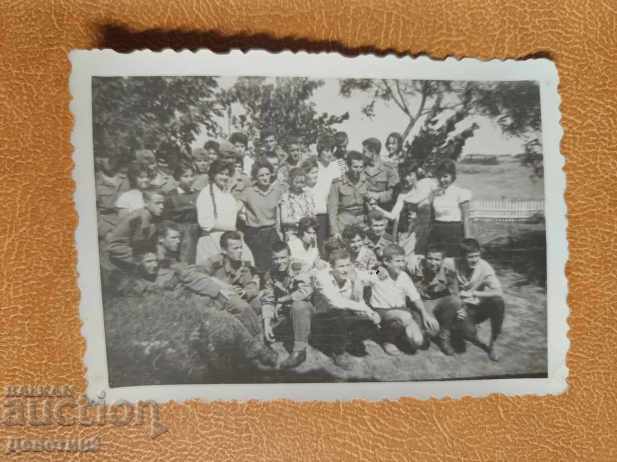 Uniformed and civilian youths outdoors