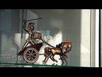 Roman chariot with a warrior, a symbol of triumph and strength