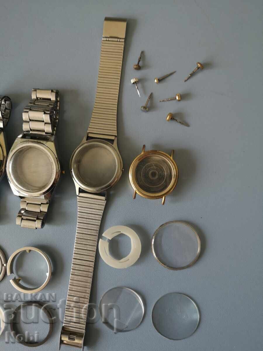 Auction  Lot of watch cases, bracelets, crowns with stems, crystals, gaskets