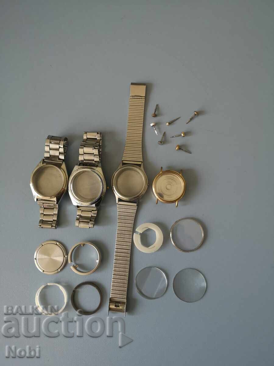 Lot of watch cases, bracelets, crowns with stems, crystals, gaskets