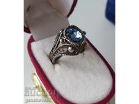 Revival period silver filigree ring with blue topaz