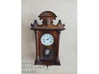 Wall clock with pendulum
