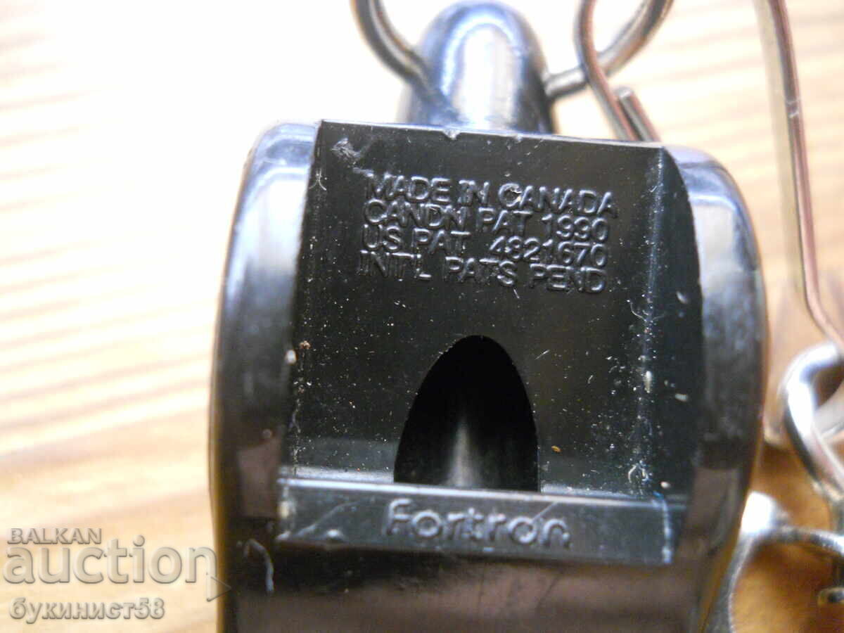 Delivery of Whistle of a Hockey Referee - Canada
