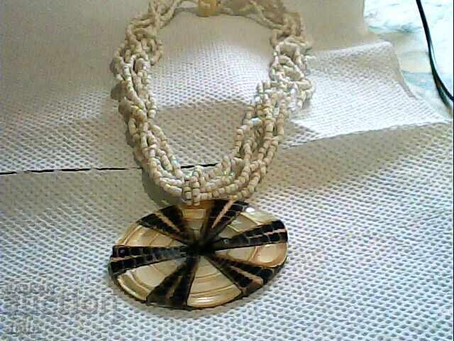 Beautiful necklace made of mother-of-pearl and beads Beautiful necklace made of mother-of-pearl and beads