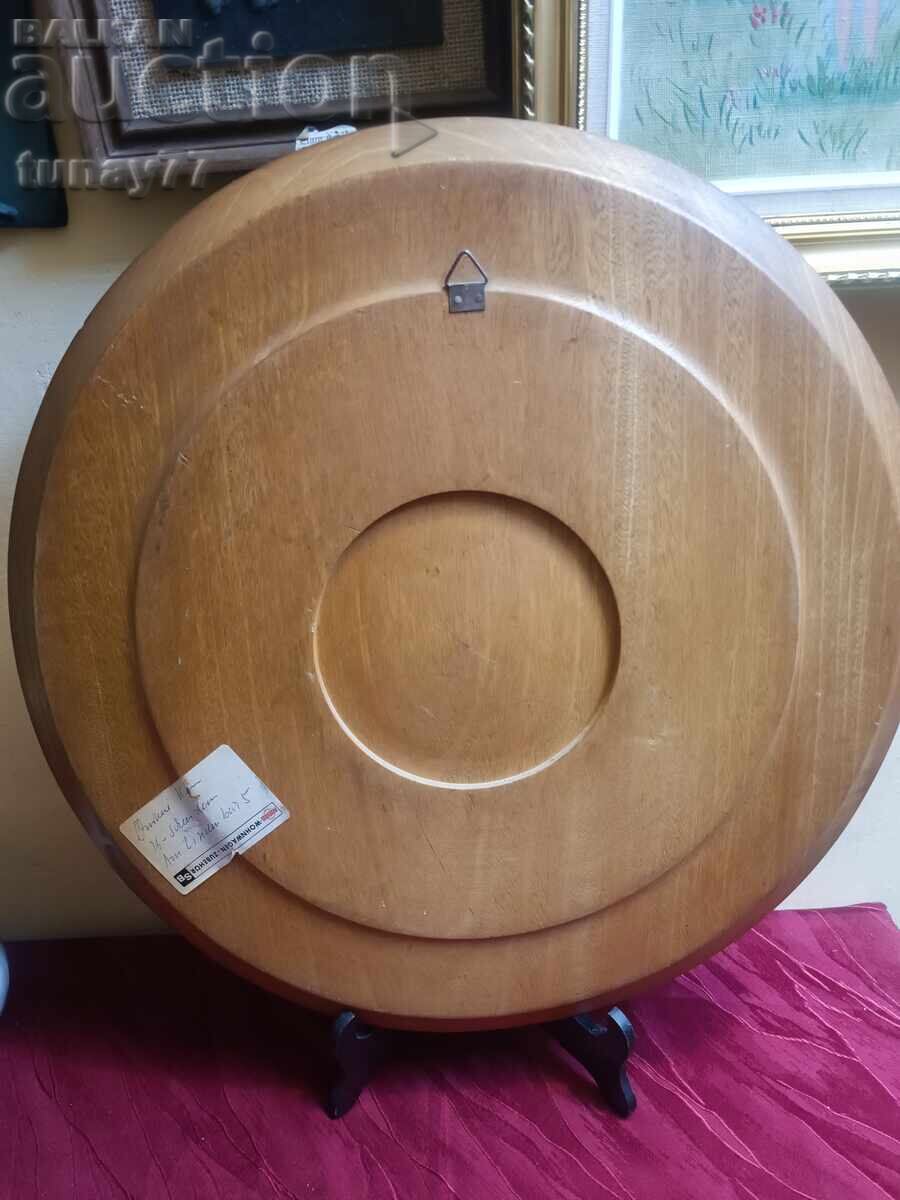 The artwork is set in a massive, round wooden frame - 5