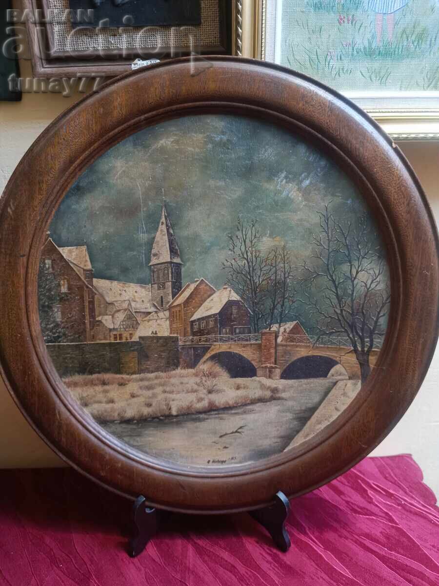 The artwork is set in a massive, round wooden frame