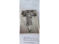 Photo Sofia Young woman in front of the Royal Palace fence