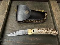 Pocket/folding knife. Damascus steel, deer antler